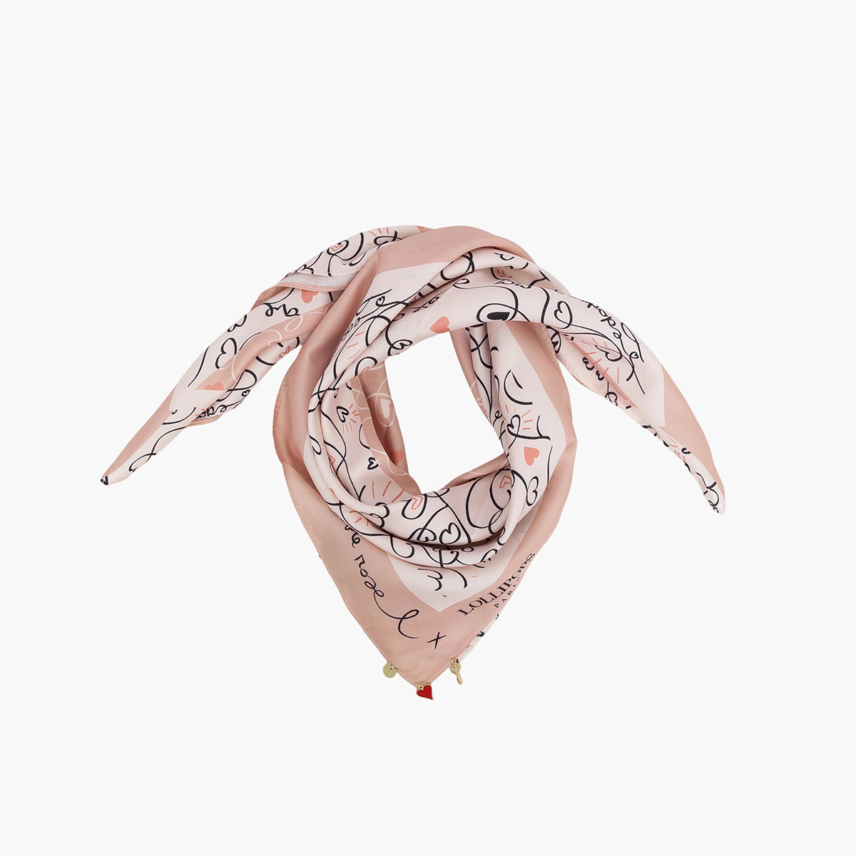 Foulard rose poudré plié avec dessins de traits et cœurs noirs