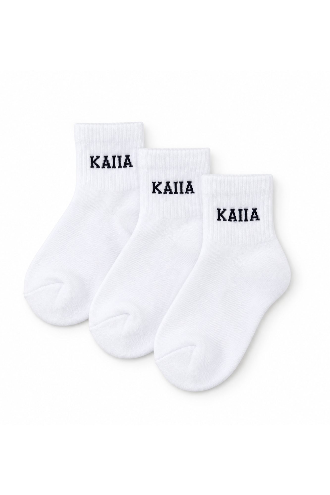 Three pairs of white ribbed ankle socks with black text on cuff